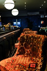 A softly lit scene of the bar’s minimalist interior, highlighting the subtle ö motif in decor.