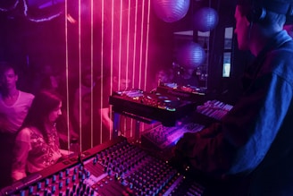 a dj mixing music in a dark room