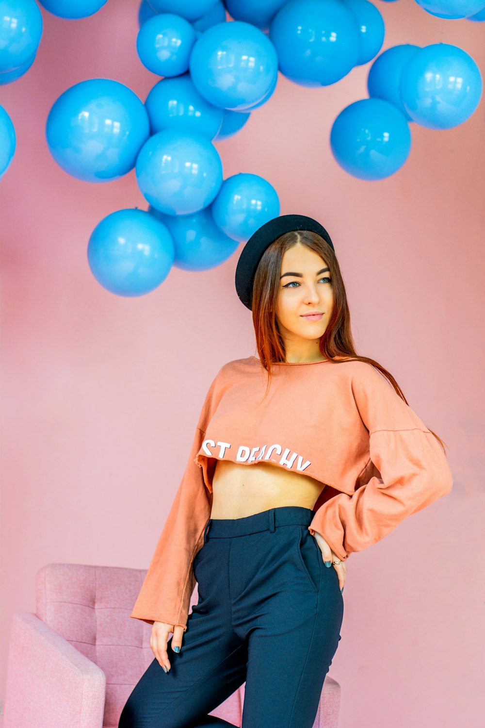 woman in brown long sleeve shirt and black skirt