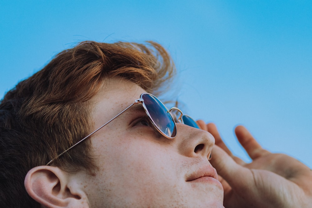 woman wearing silver framed aviator sunglasses