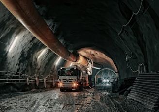 red and black truck in tunnel