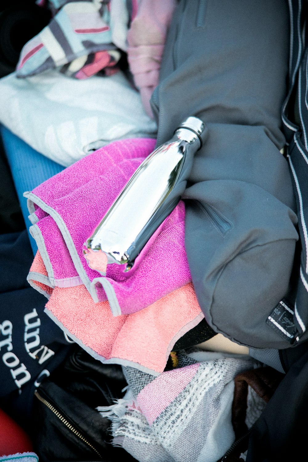 stainless steel tube on black and pink textile