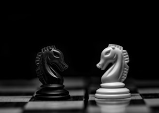 white ceramic figurine on black table