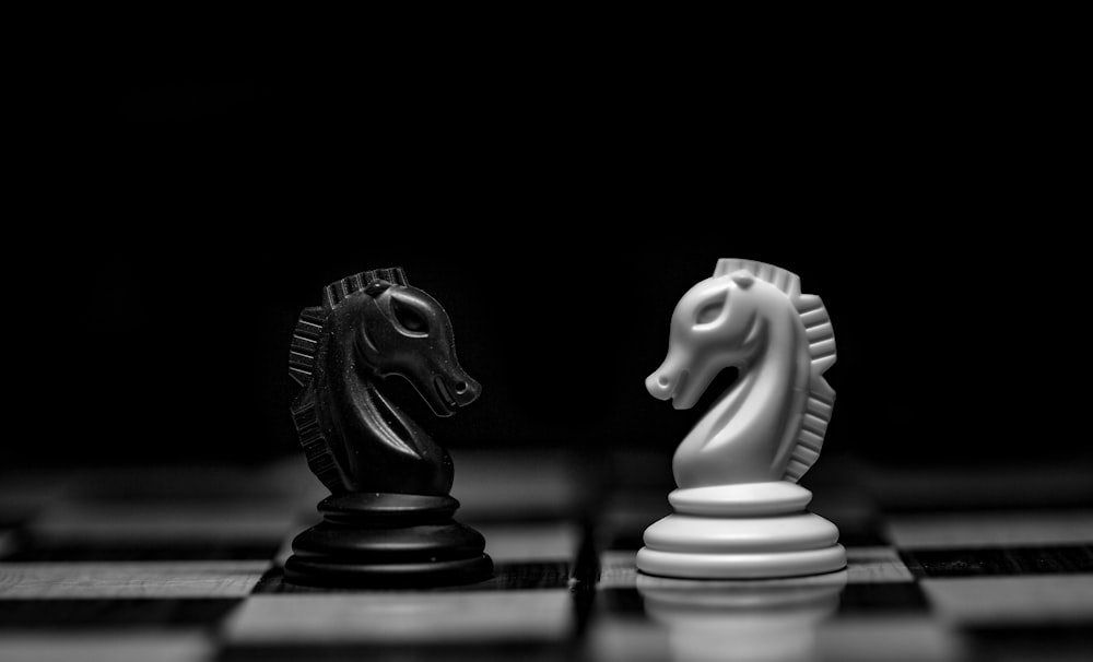 white ceramic figurine on black table