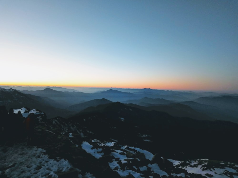 black and white mountains under blue sky during daytime