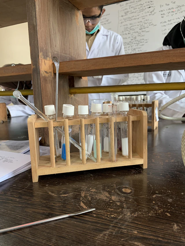 Student conducting science experiment with test tubes