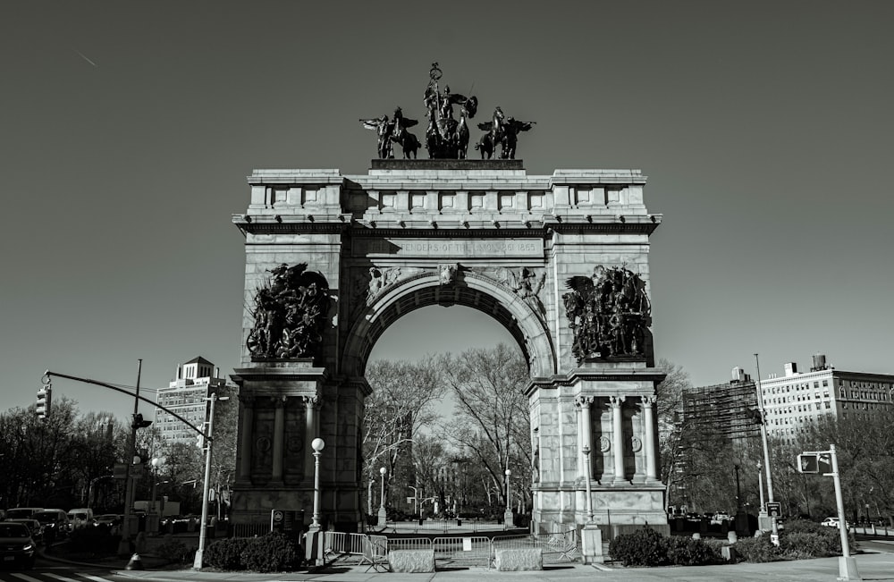 grayscale photo of man riding horse statue