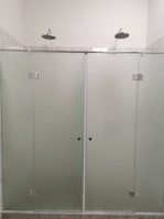 Frosted glass shower enclosure creating a serene and private shower area.