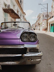 purple car parked on street during daytime