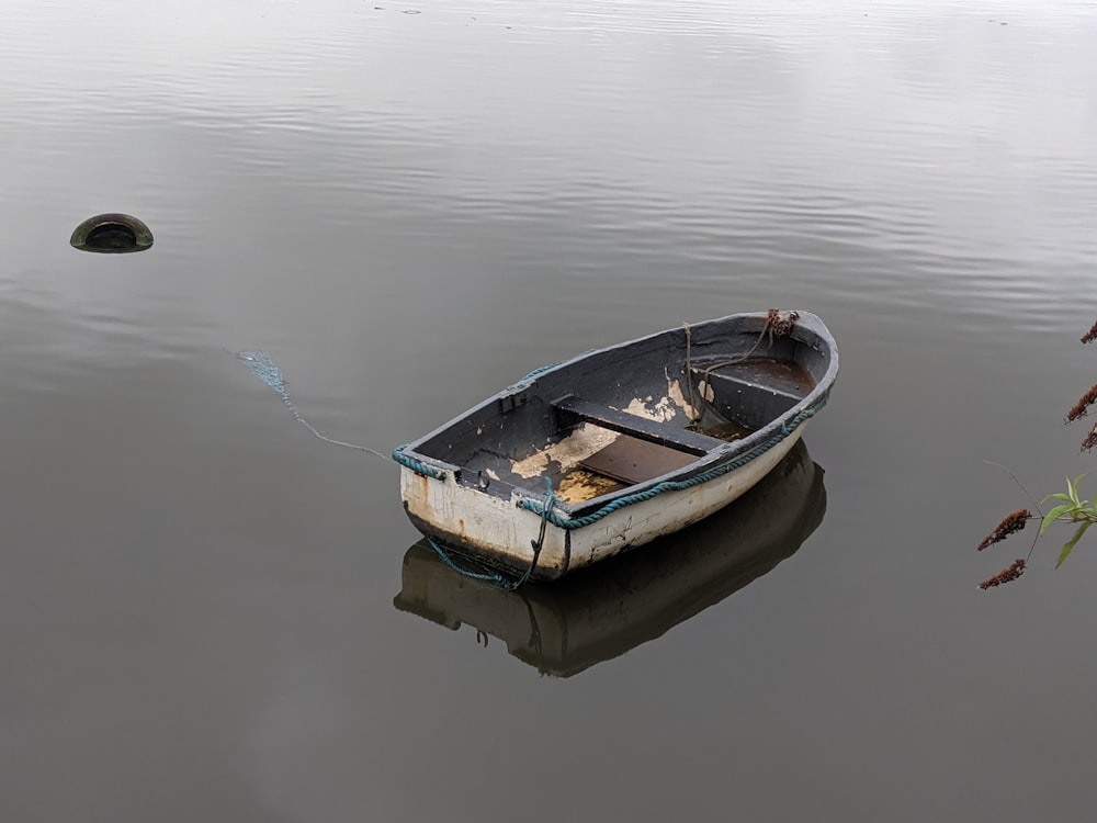 brown and black boat on body of water during daytime