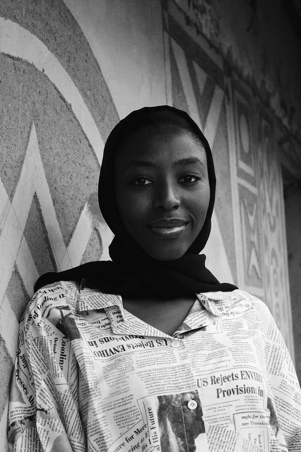 woman in hijab and white and black stripe shirt