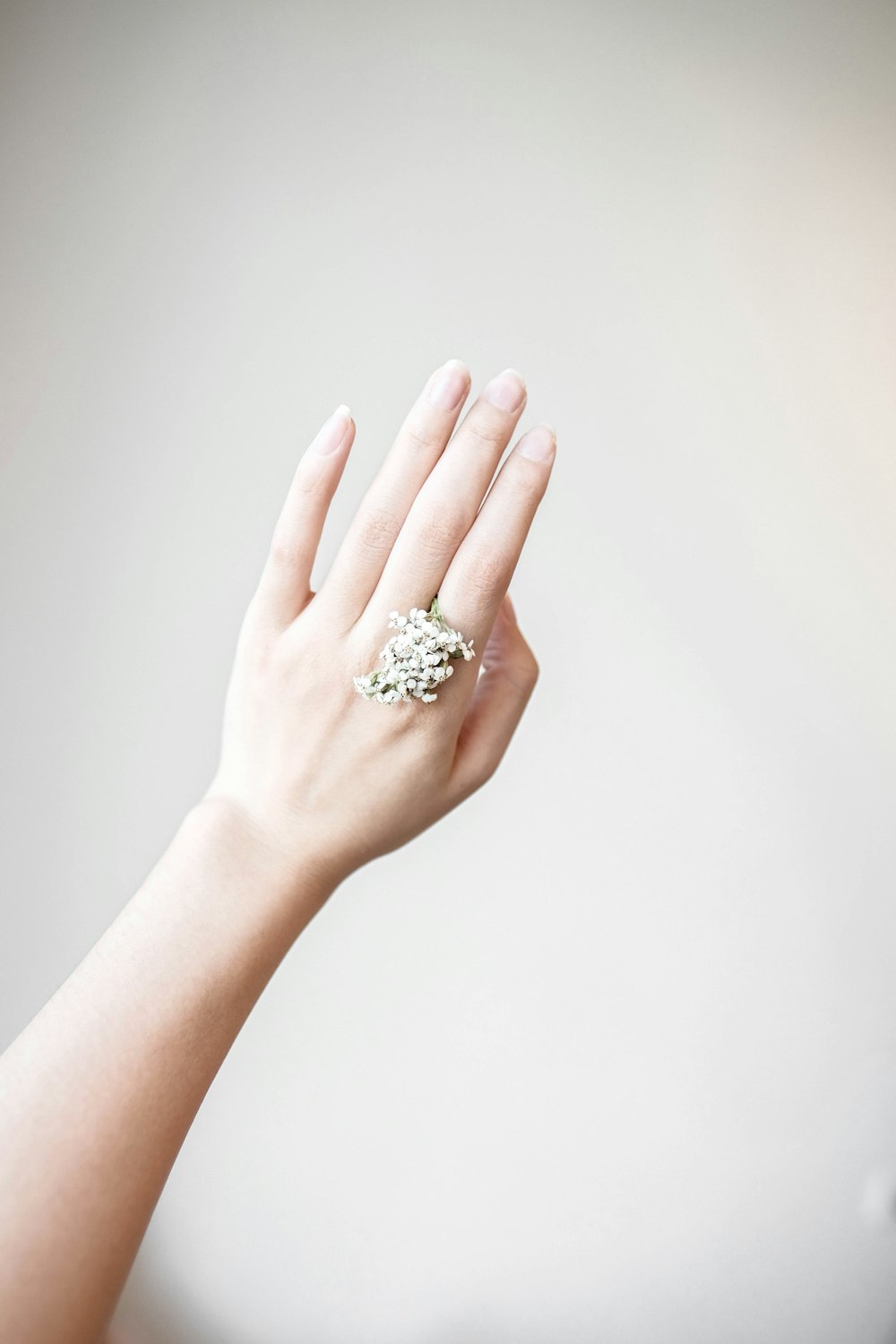 person wearing silver diamond ring