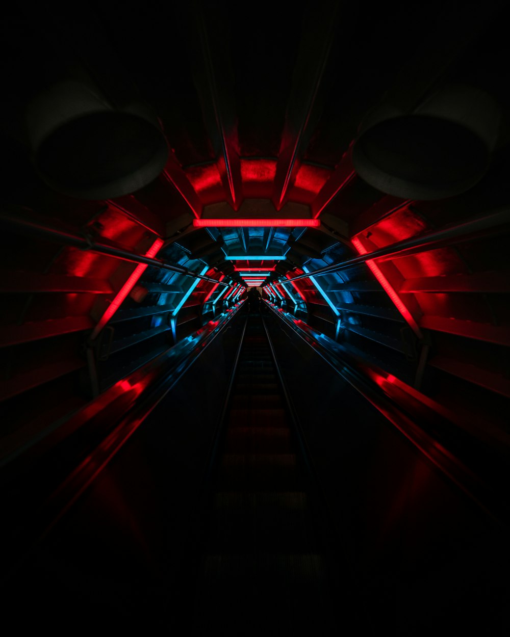 red and black tunnel with light