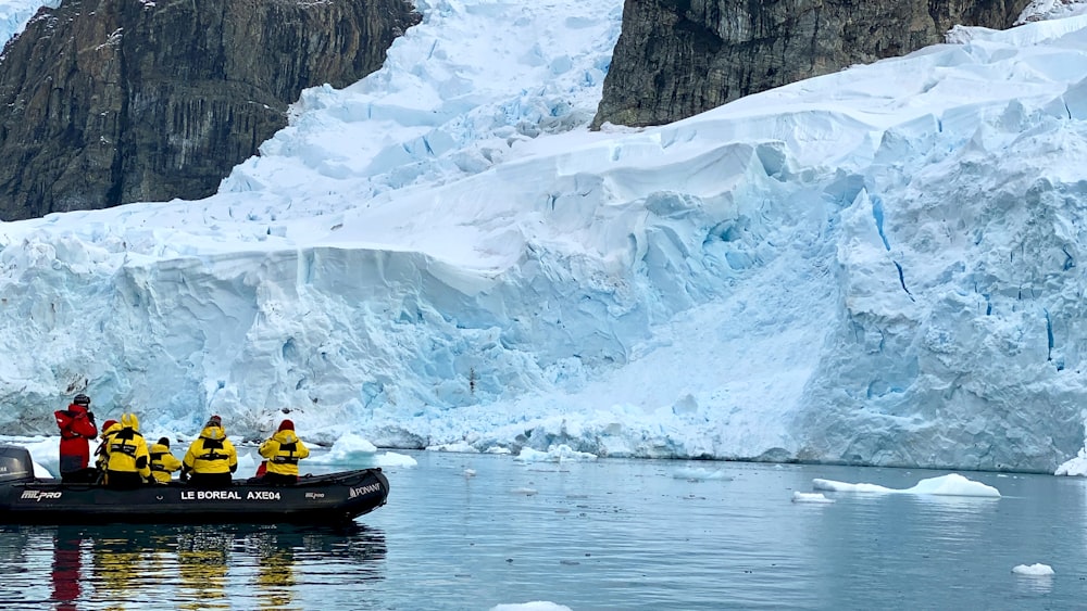 person riding yellow kayak on river during daytime