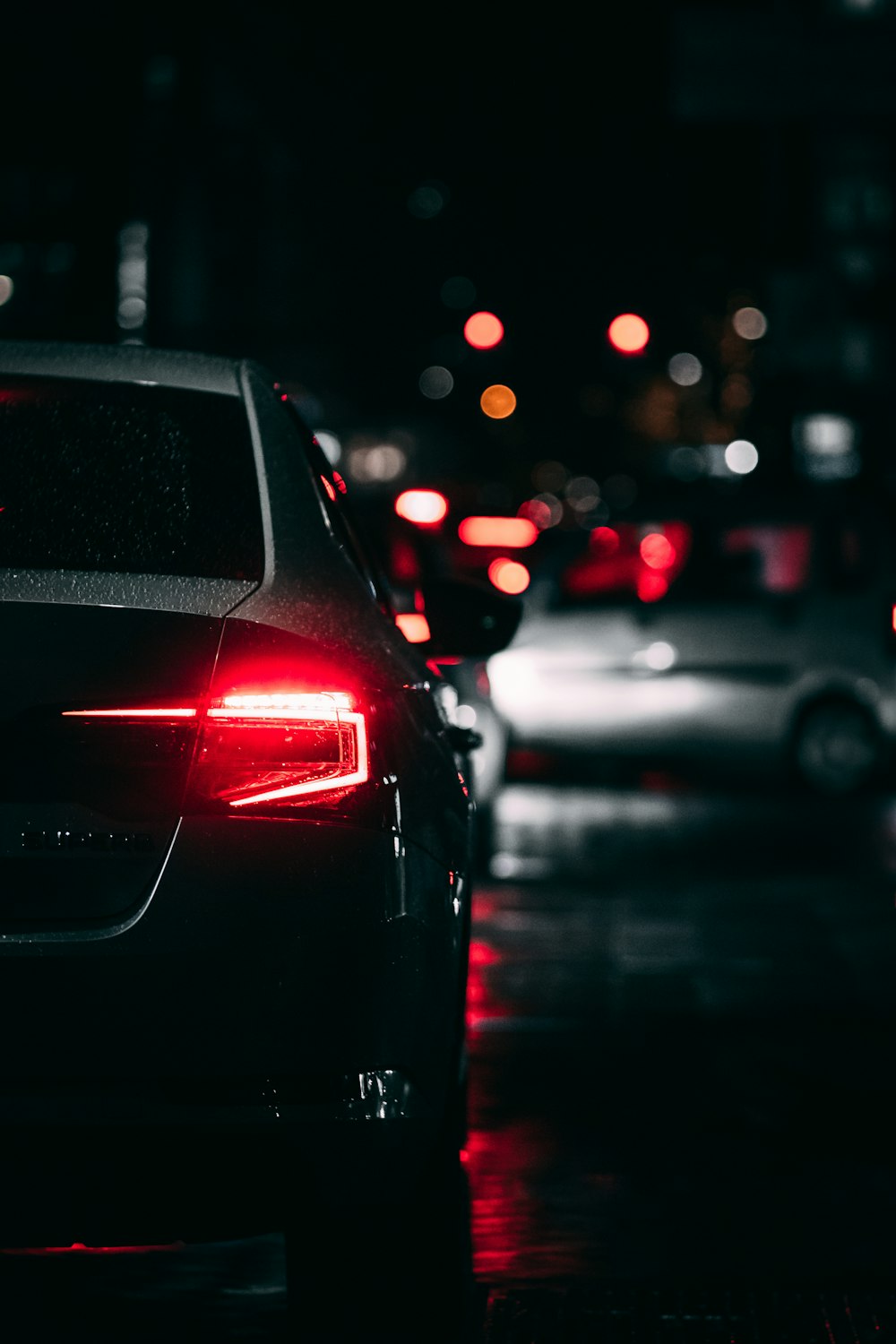 black car on road during night time