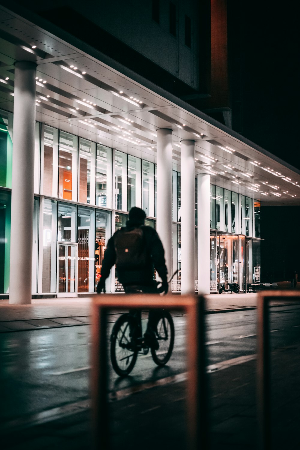 man in black jacket riding bicycle