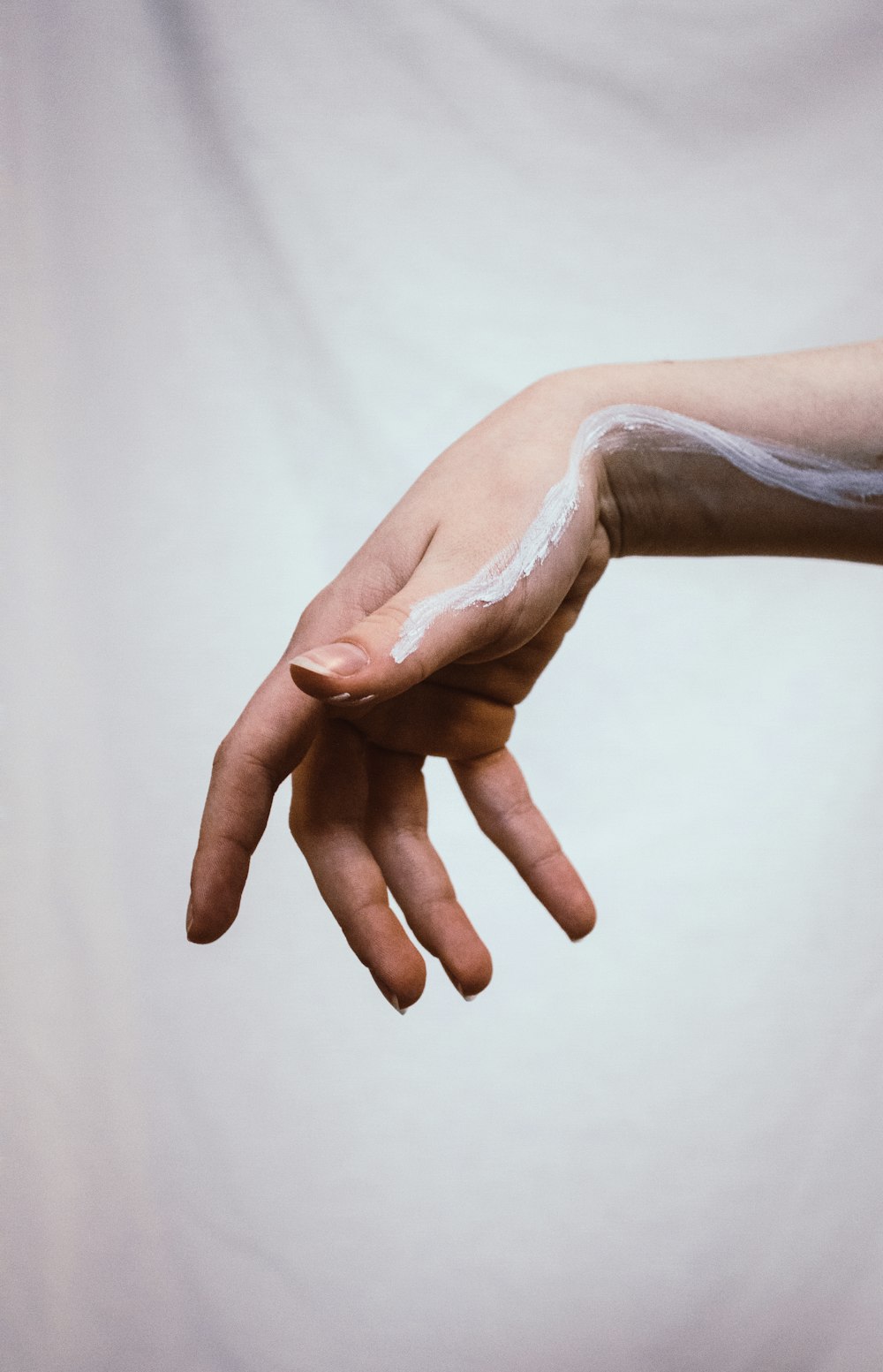 persons hand with white powder