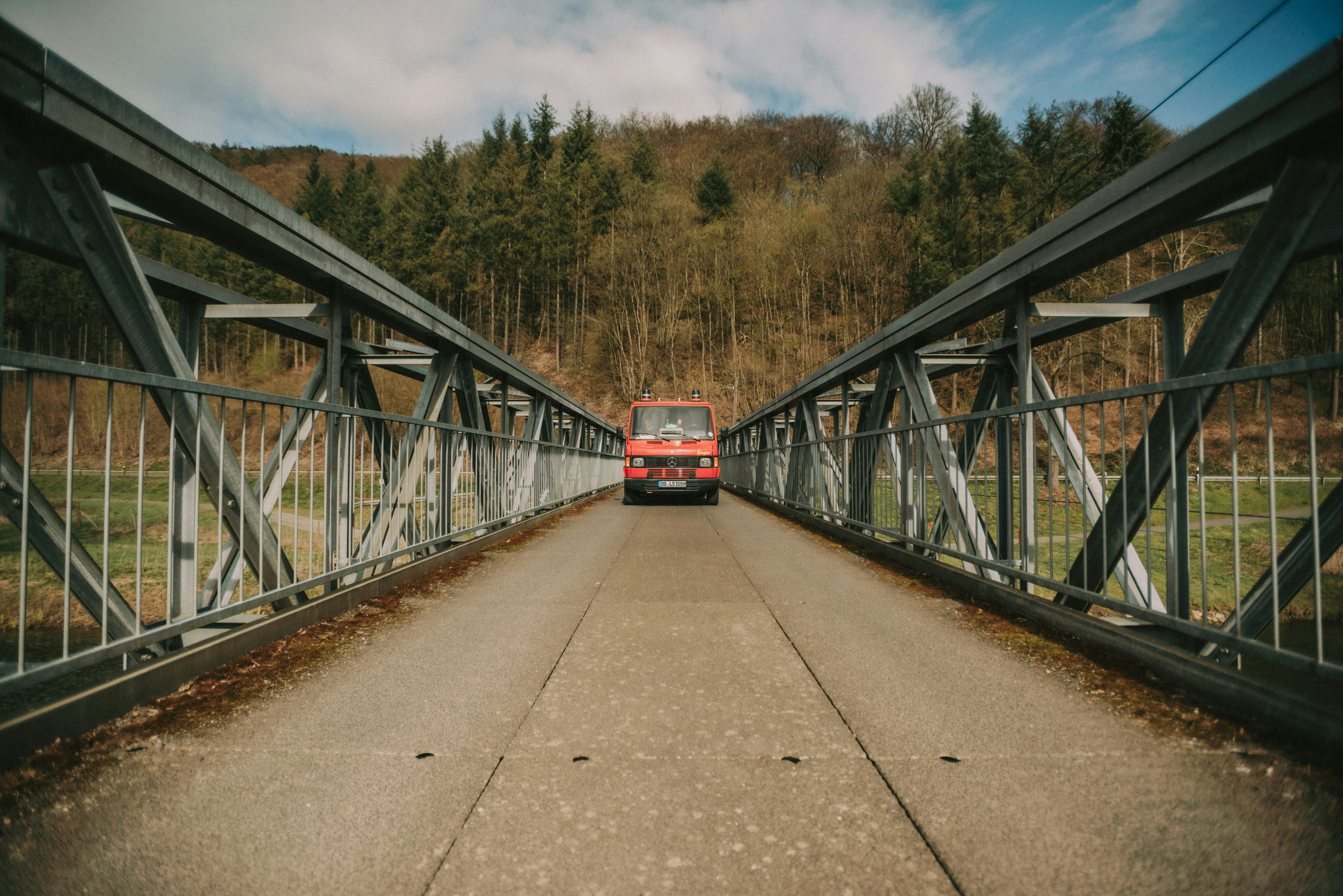 red and white train on rail road during daytime