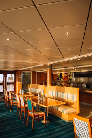 A cozy dining area with rustic wooden tables and nautical decor reflecting the spirit of Captain Cook Charters.