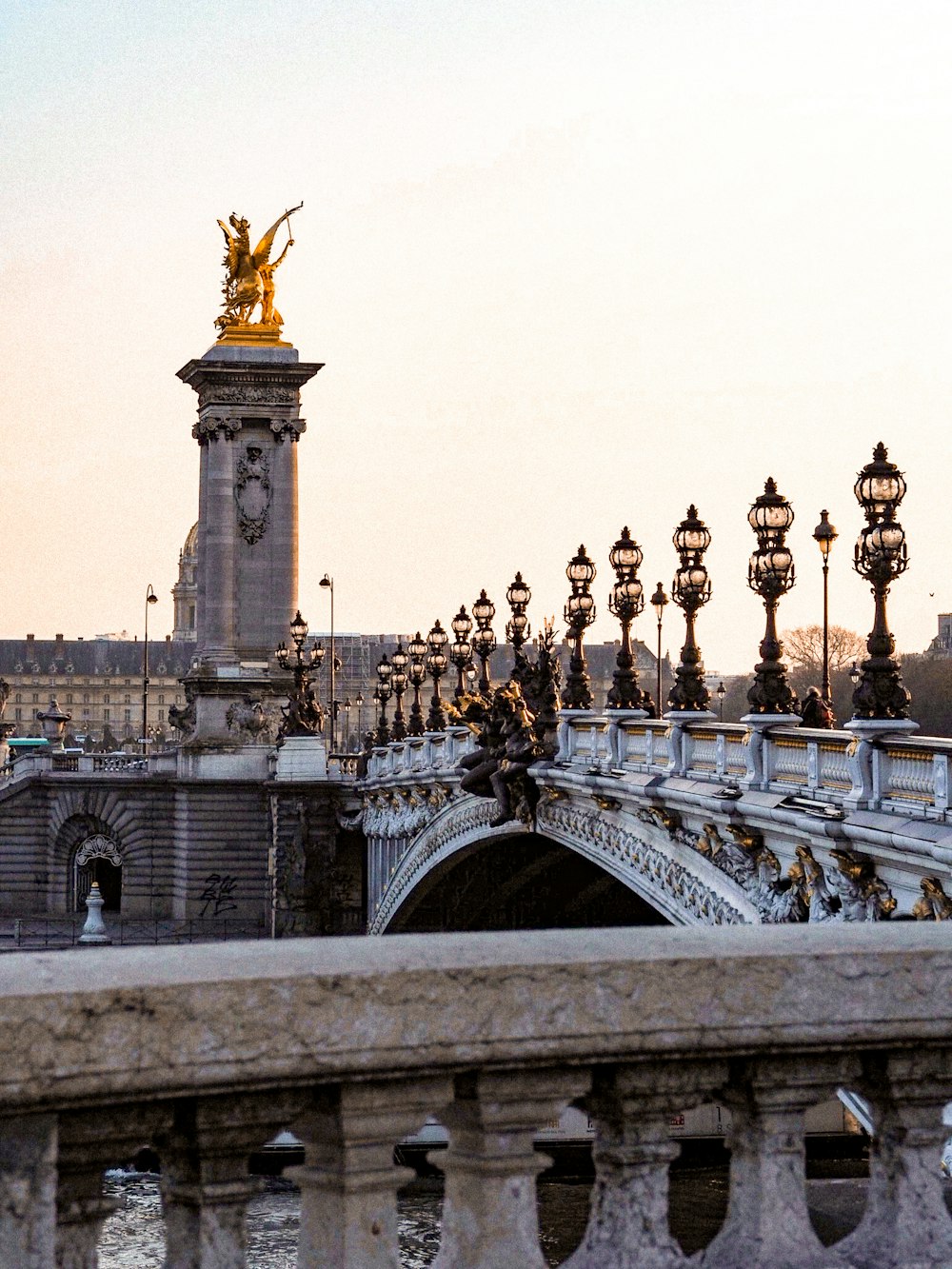 people walking on gray concrete bridge during daytime