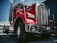 red and white truck on black asphalt road