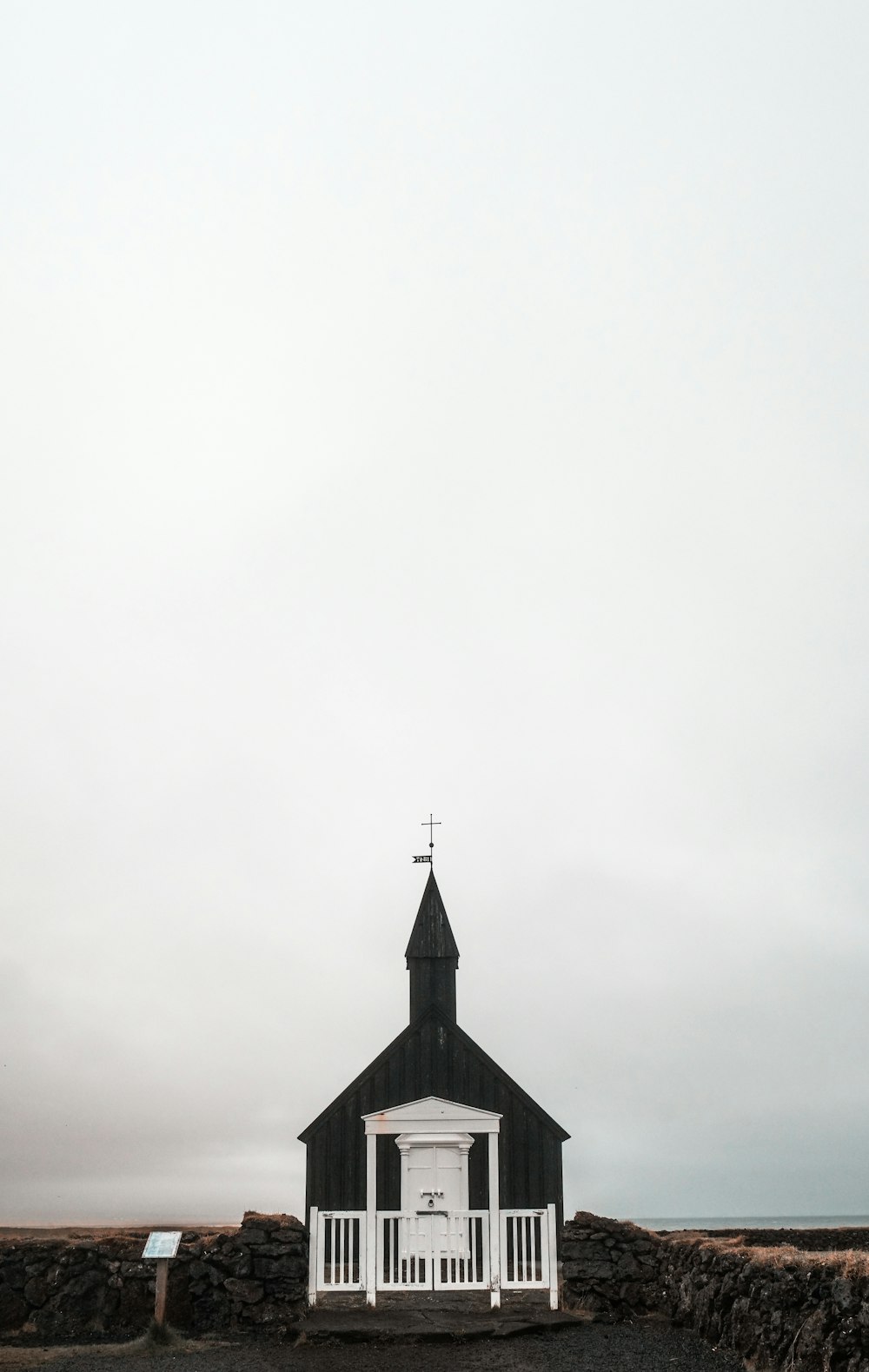 black and white cathedral under cloudy sky