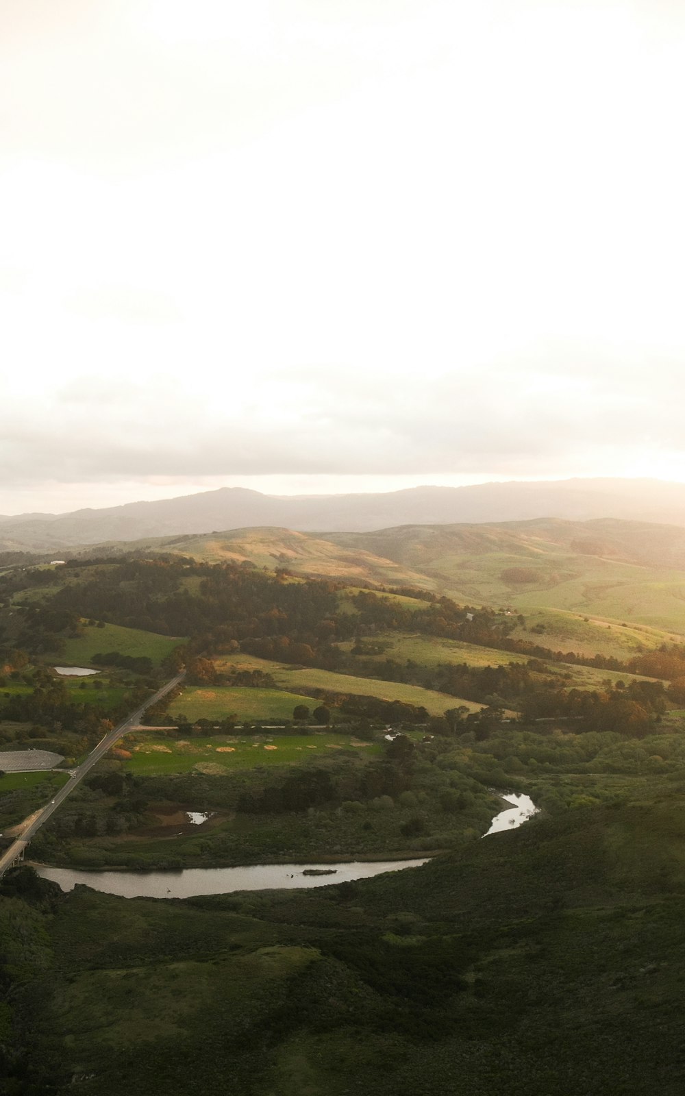 aerial view of green and brown mountains during daytime