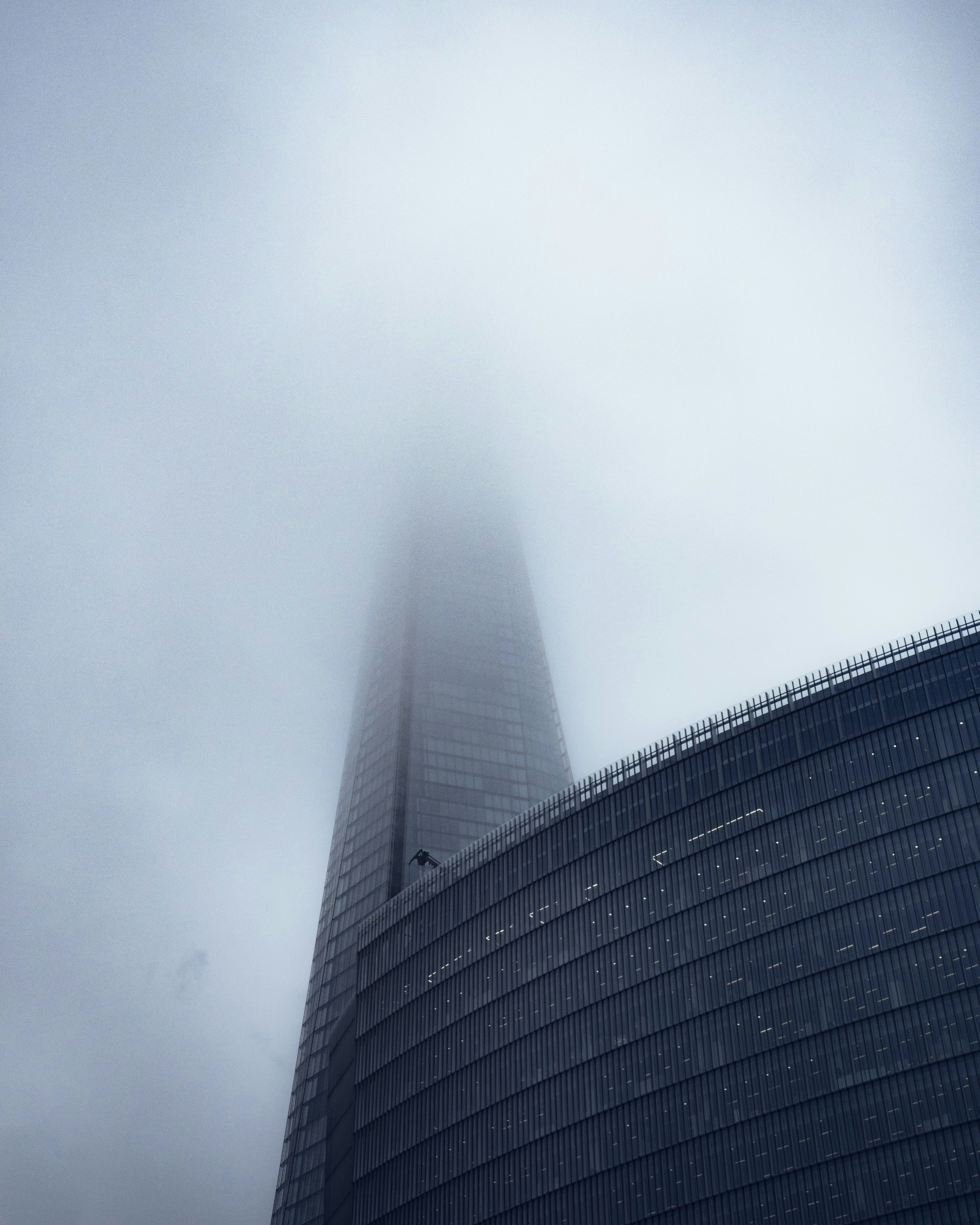 black concrete building under white clouds
