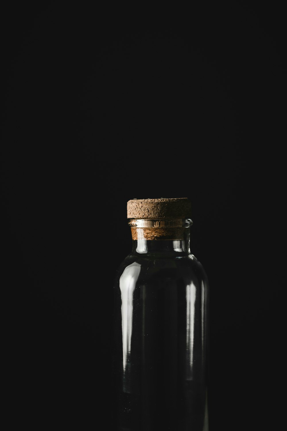 black glass bottle with white background