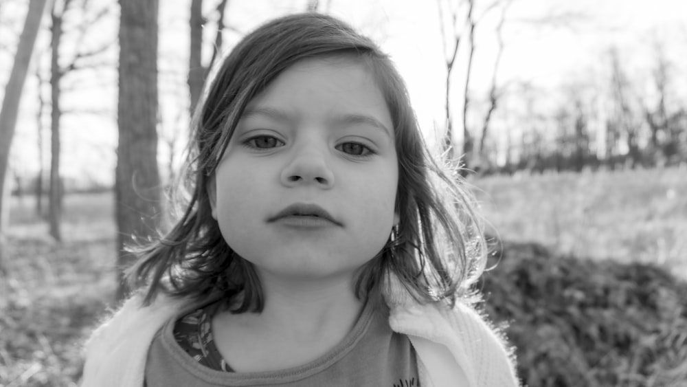 grayscale photo of girl in crew neck shirt