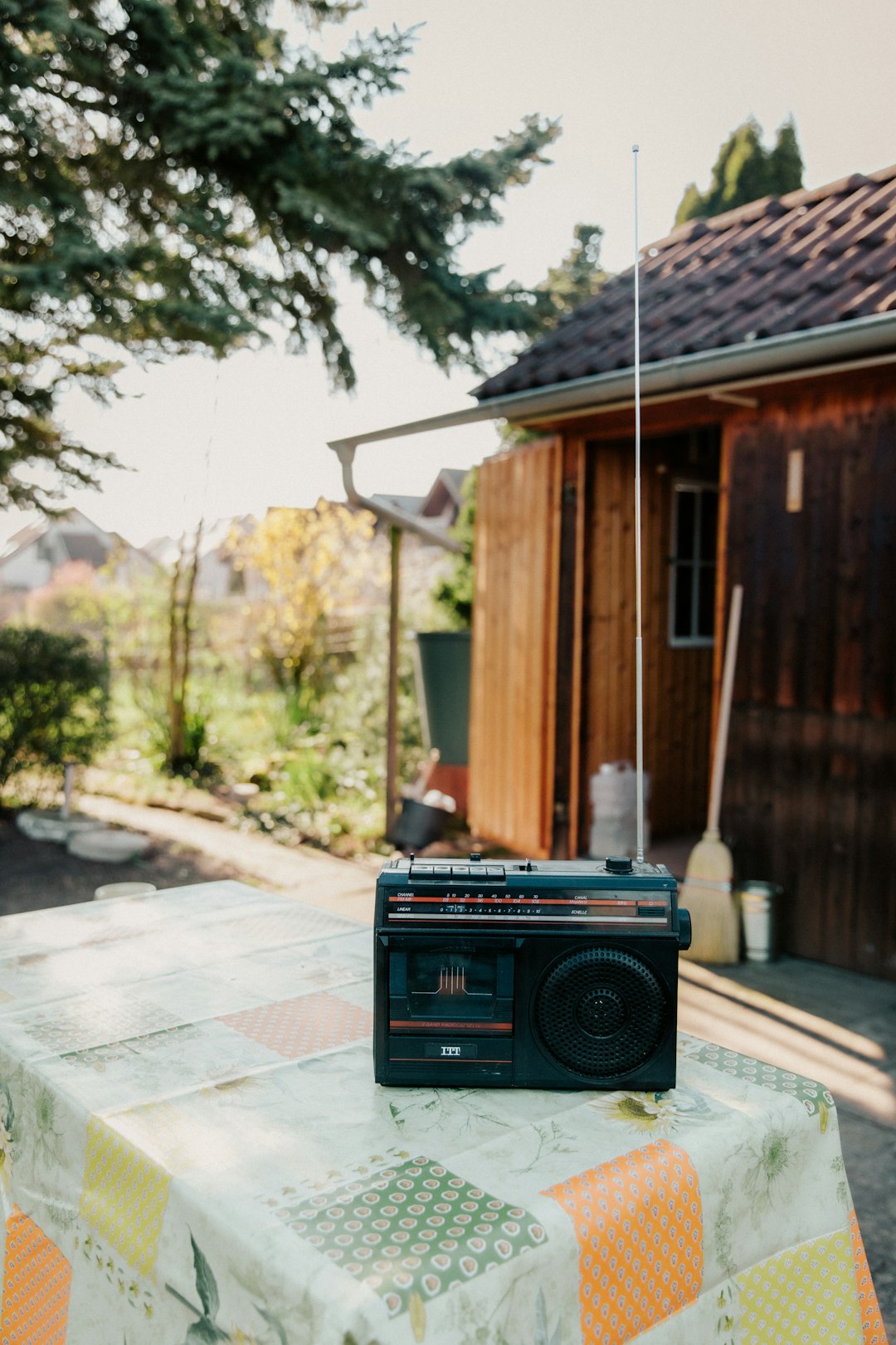  black radio on gray concrete floor radio