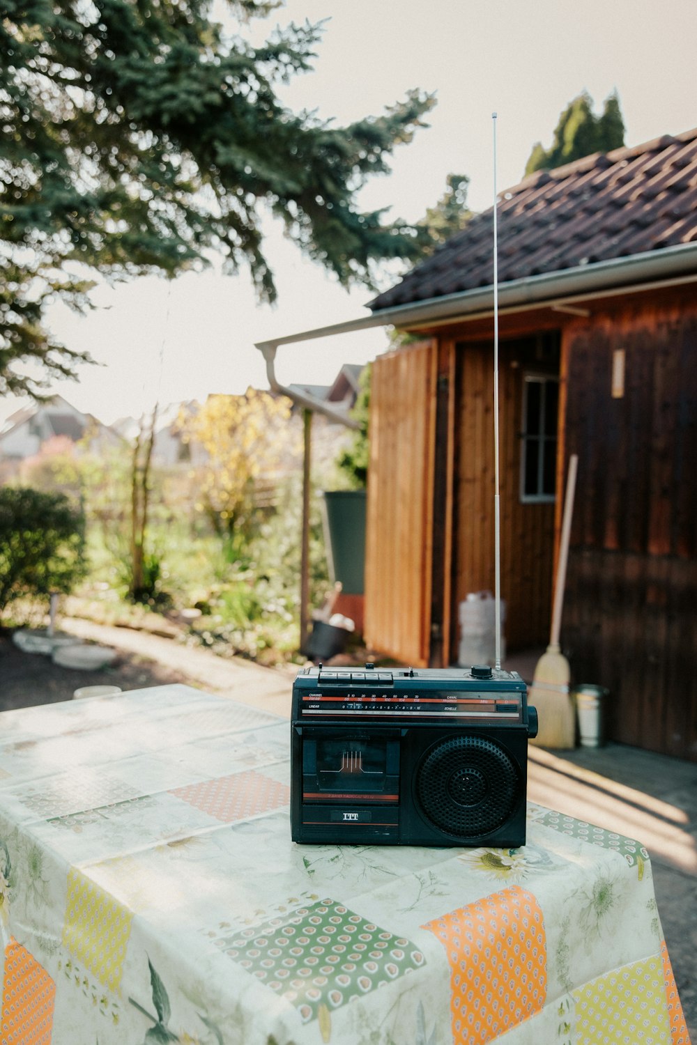 black radio on gray concrete floor