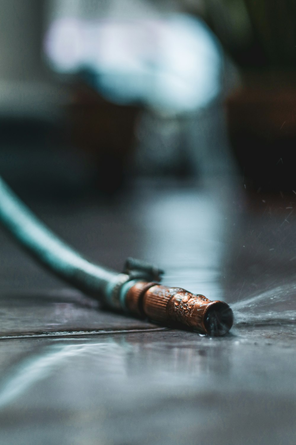 green coated wire on black wooden table