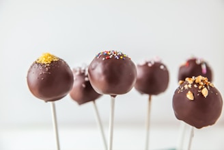 red and yellow lollipop on white surface