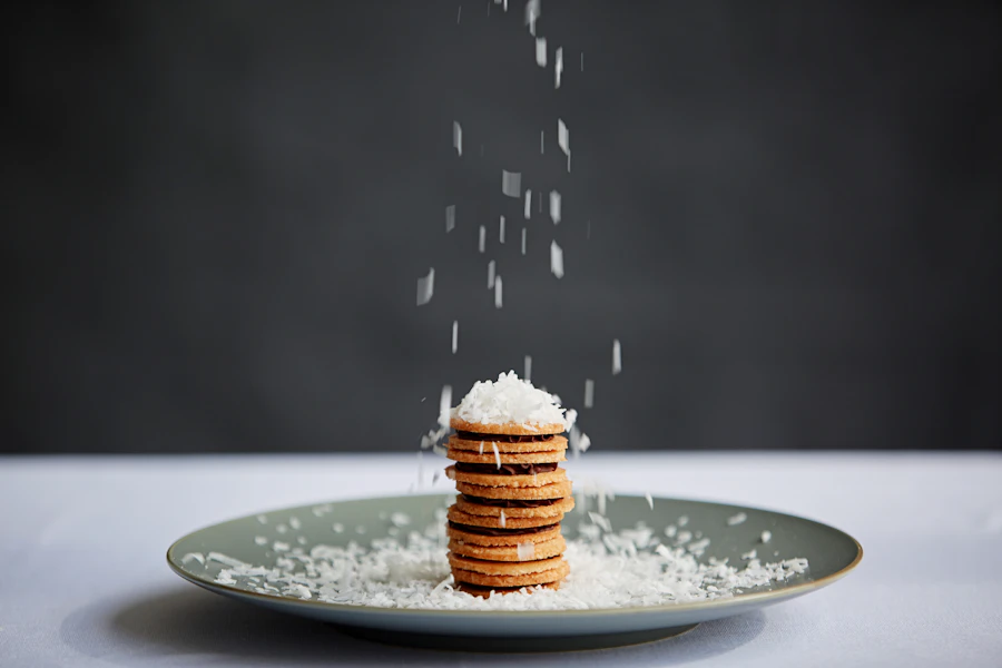 Stack of cookies topped with shredded coconut