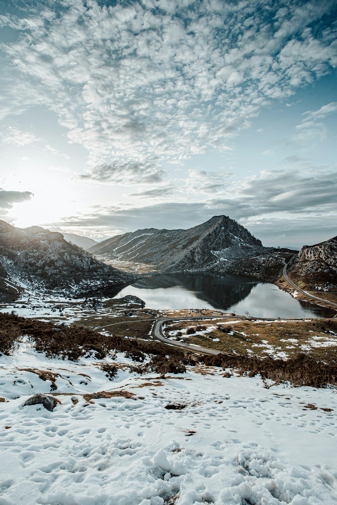 snow covered mountain under cloudy sky during daytime