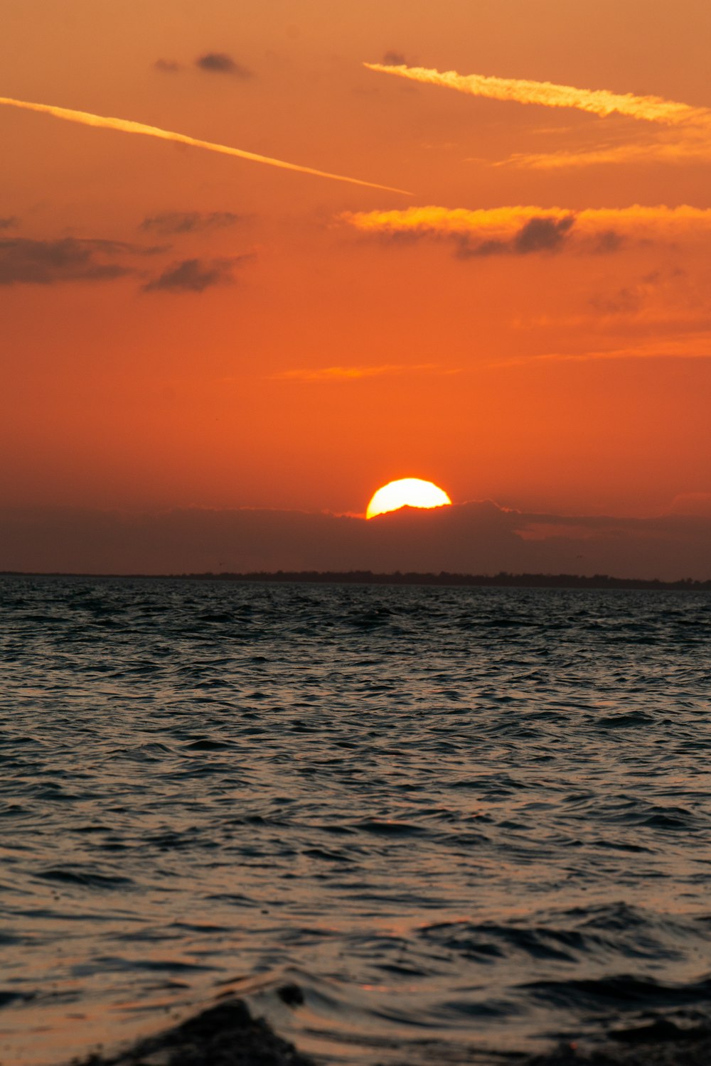 body of water during sunset