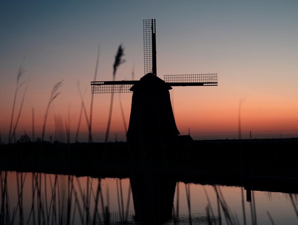 silhouette of statue during sunset