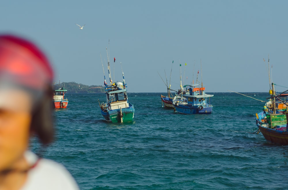 white and blue boat on sea during daytime