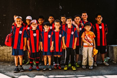 A group of sports team members proudly wearing matching custom printed jerseys.