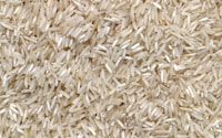 white rice grains on brown wooden table