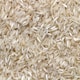 white rice grains on brown wooden table
