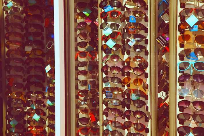 red and brown sunglasses on white frame