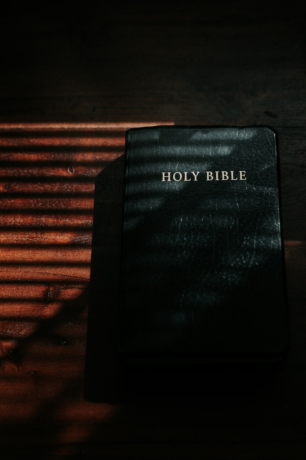 black and white book on brown wooden table