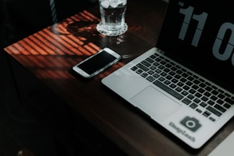 silver iphone 6 on macbook pro