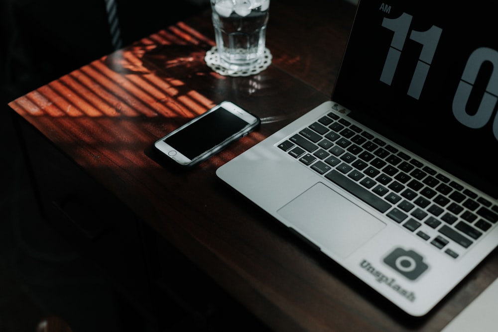 silver iphone 6 on macbook pro