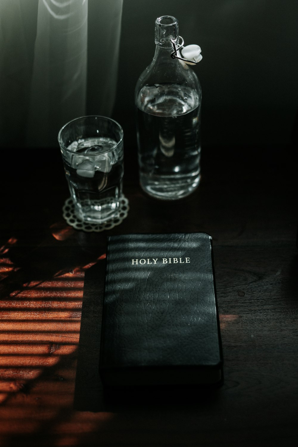 clear drinking glass on black table