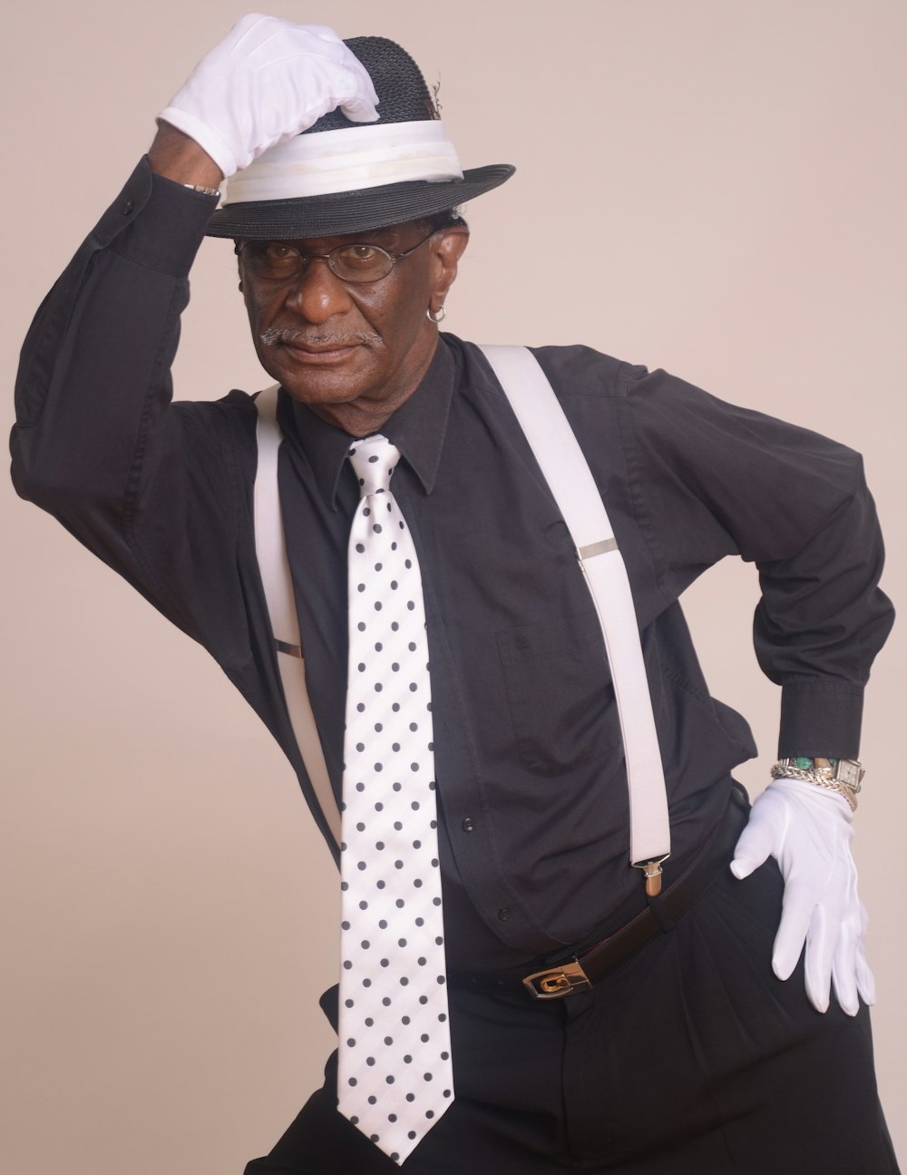 man in black suit jacket and white hat