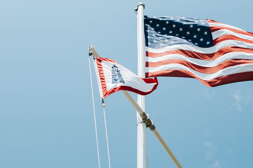 us a flag on pole during daytime