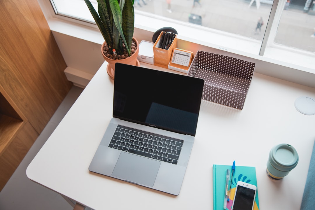 macbook pro on white table